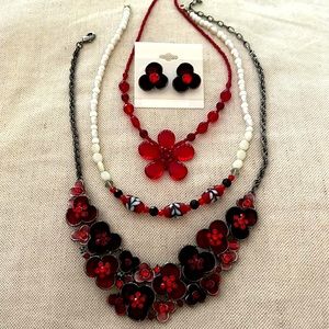 Lady in red! Red beaded necklaces and metal and enamel necklace and earrings.
